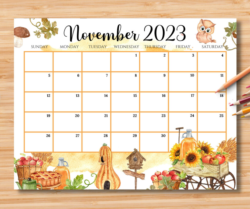 A Calendar With An Image Of Autumn And Fall Items On It Next To Pencils